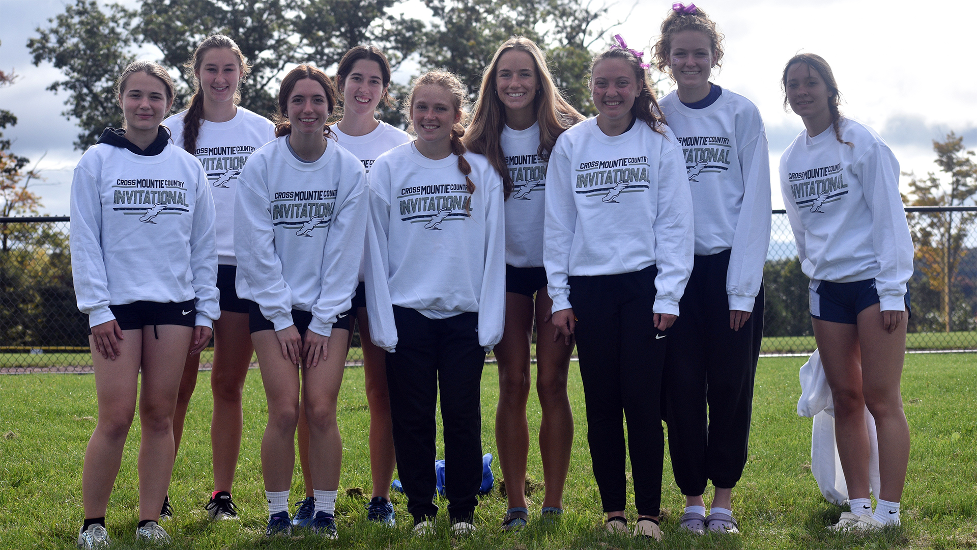 Laci Schwirian and Ella Cloak (seventh and eighth from left). Photo courtesy of Mount Aloysius Sports Information.