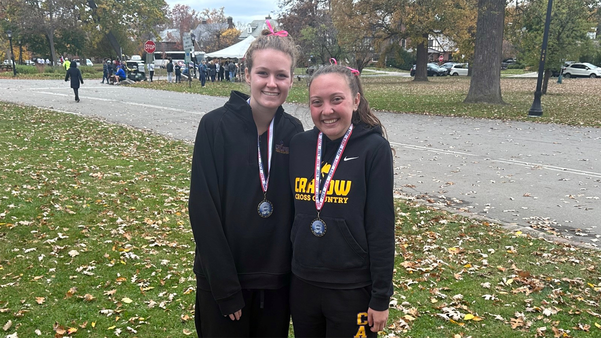 Ella Cloak and Laci Schwirian with their all-conference medals post-race. Photo by Lou Zadecky.